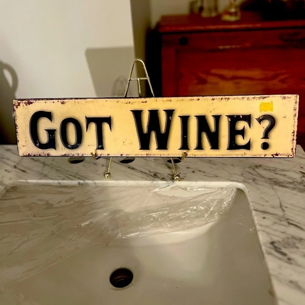 A wall plaque for wine lovers